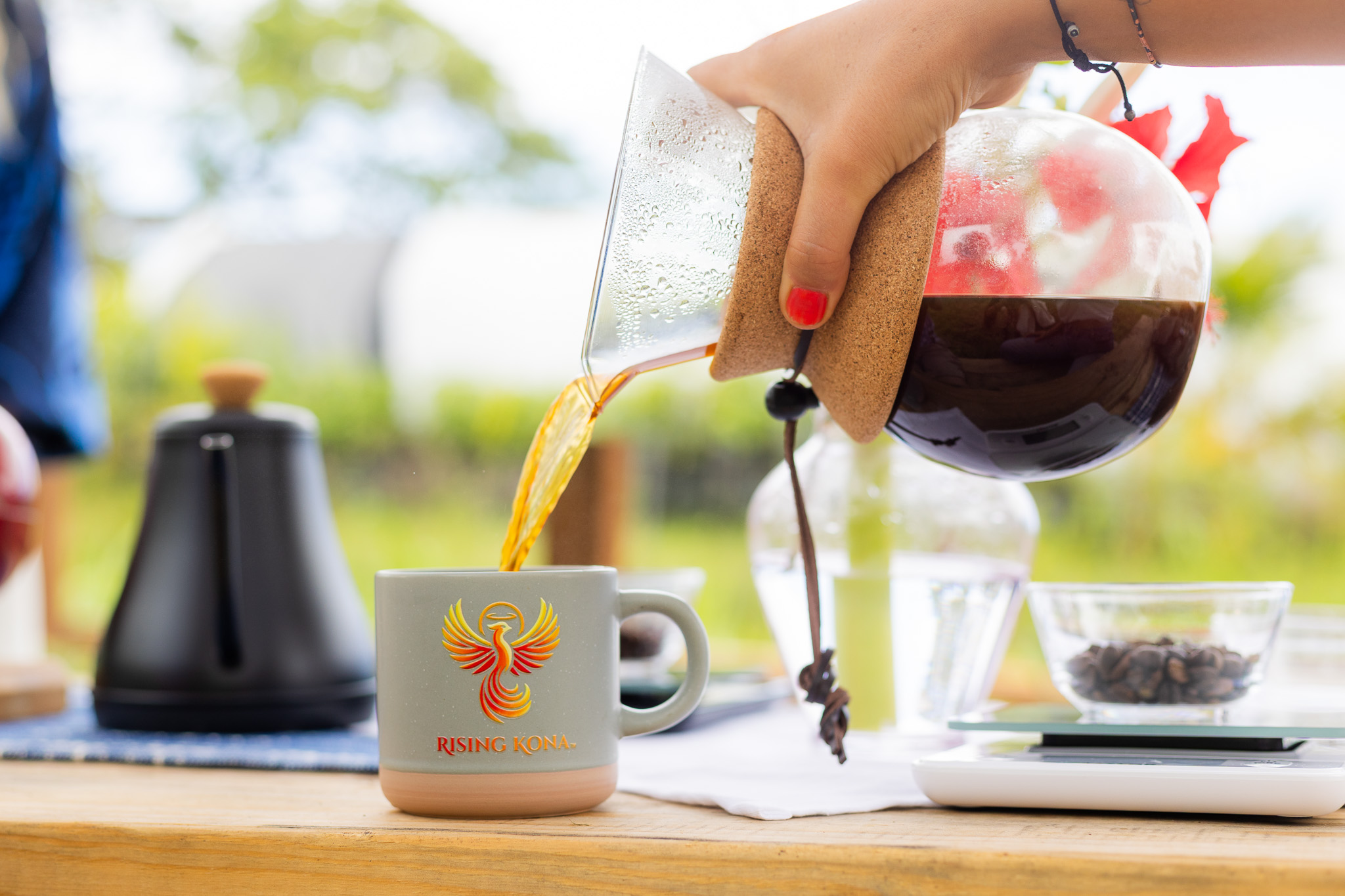Coffee pouring into Rising Kona Cup